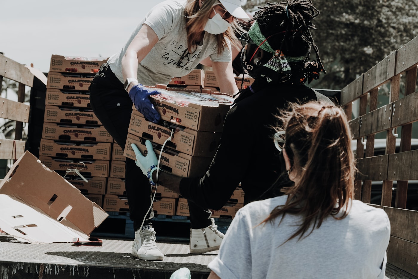 Volunteers packing food boxes for neighbors